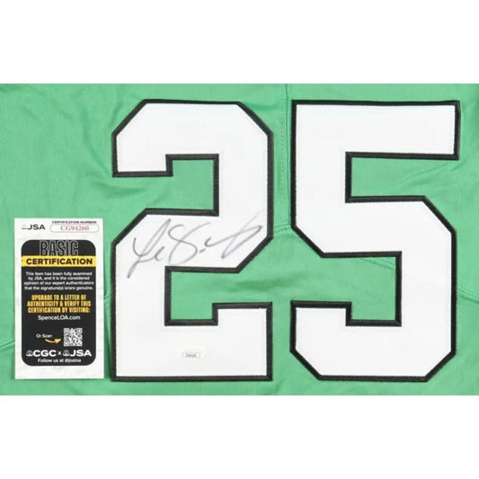 Green sports jersey with ’25’’ and a signature.