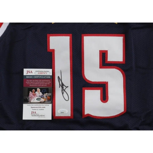 Signed blue sports jersey with white and red number 15.