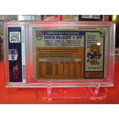 A 1976 Topps Mike McCoy Green Bay Packers football card in a PSA slab.