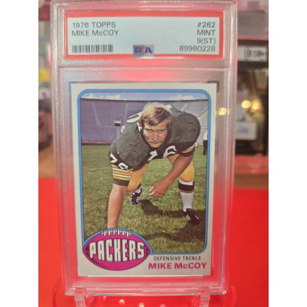 Graded 1976 Topps Mike McCoy football card, Mint 9(ST).