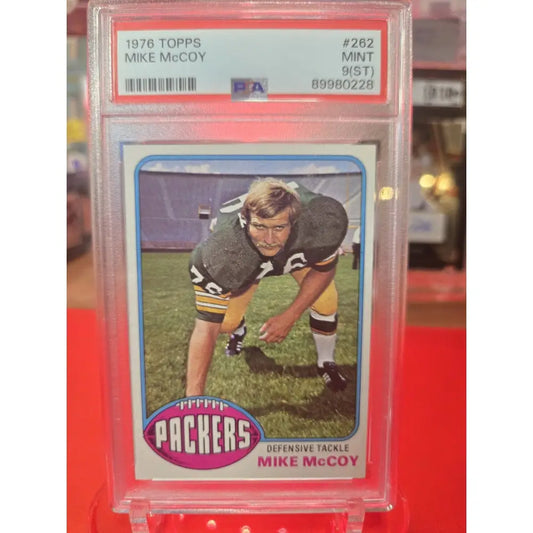 Graded 1976 Topps Mike McCoy football card, Mint 9(ST).