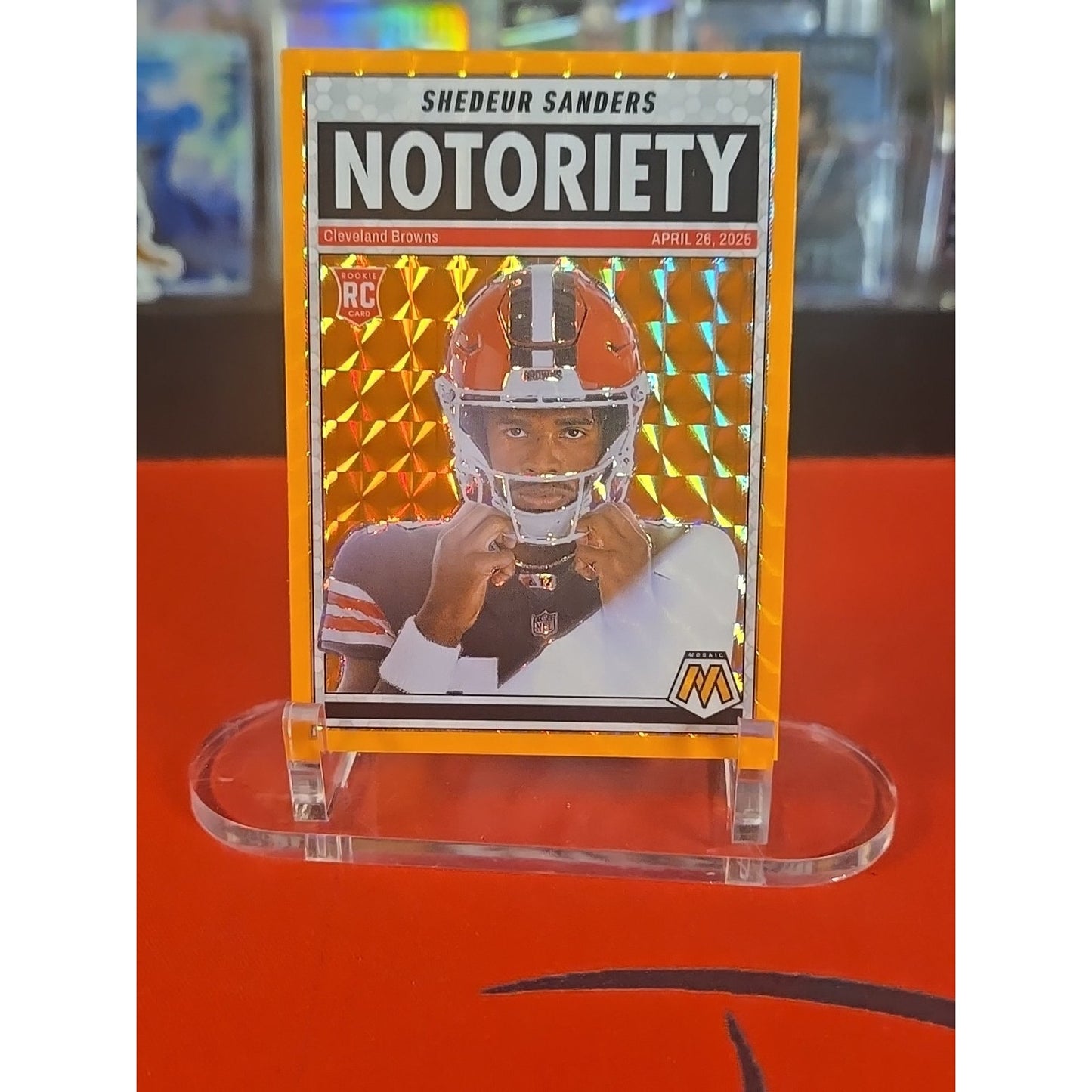 2025 Panini Mosaic - Notoriety Shedeur Sanders #13 Orange Fluorescent Mosaic...