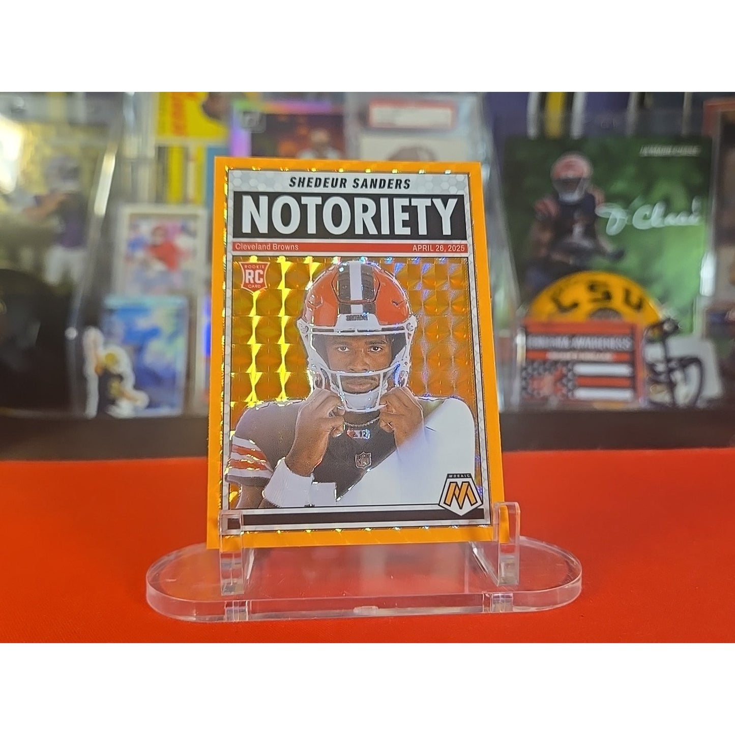 2025 Panini Mosaic - Notoriety Shedeur Sanders #13 Orange Fluorescent Mosaic...