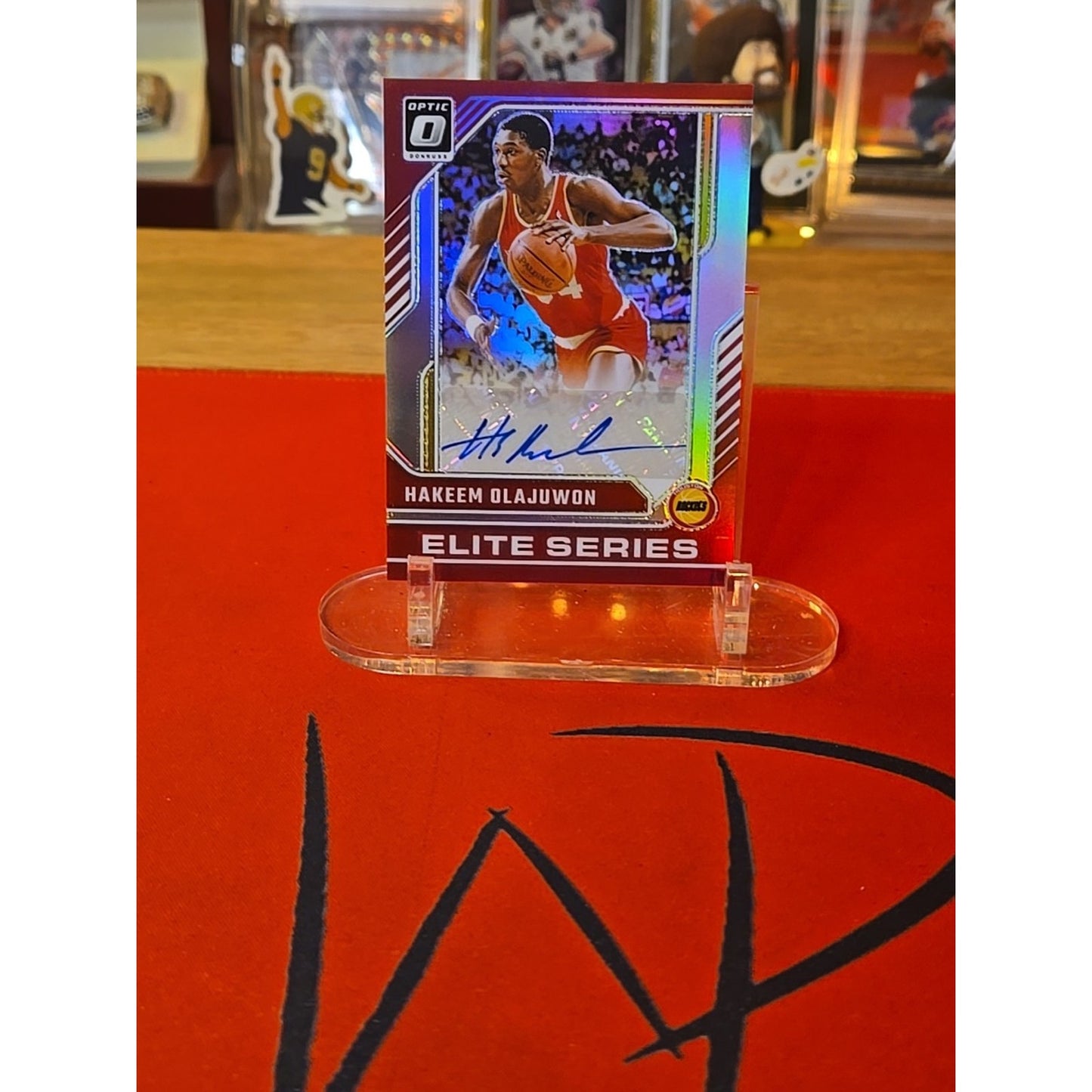 Hakeem Olajuwon /49 Auto 2024-25 Donruss Optic The Elite Series Holo