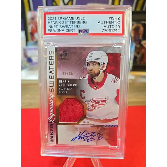 PSA-graded hockey trading card featuring Henrik Zetterberg’s autograph and a game-used jersey swatch