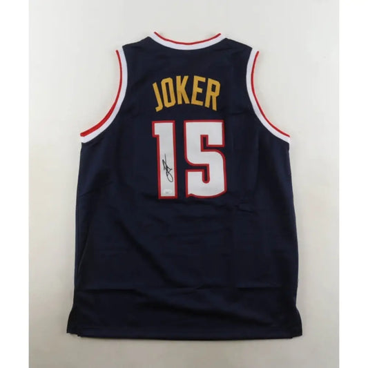 Dark blue basketball jersey with ’JOKER’ and the number ’15’’ on the back.