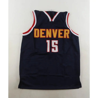 Dark blue basketball jersey with ’DENVER’ and ’15’’ in gold and white, trimmed in red and white.