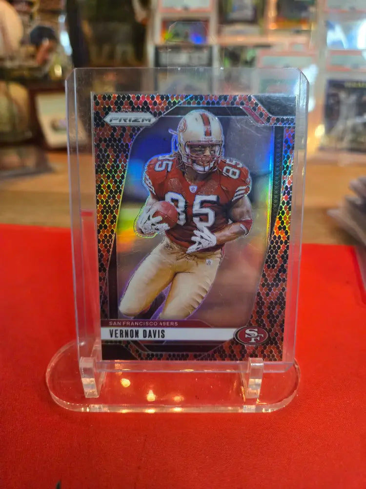 Football trading card of Vernon Davis in a clear display case.